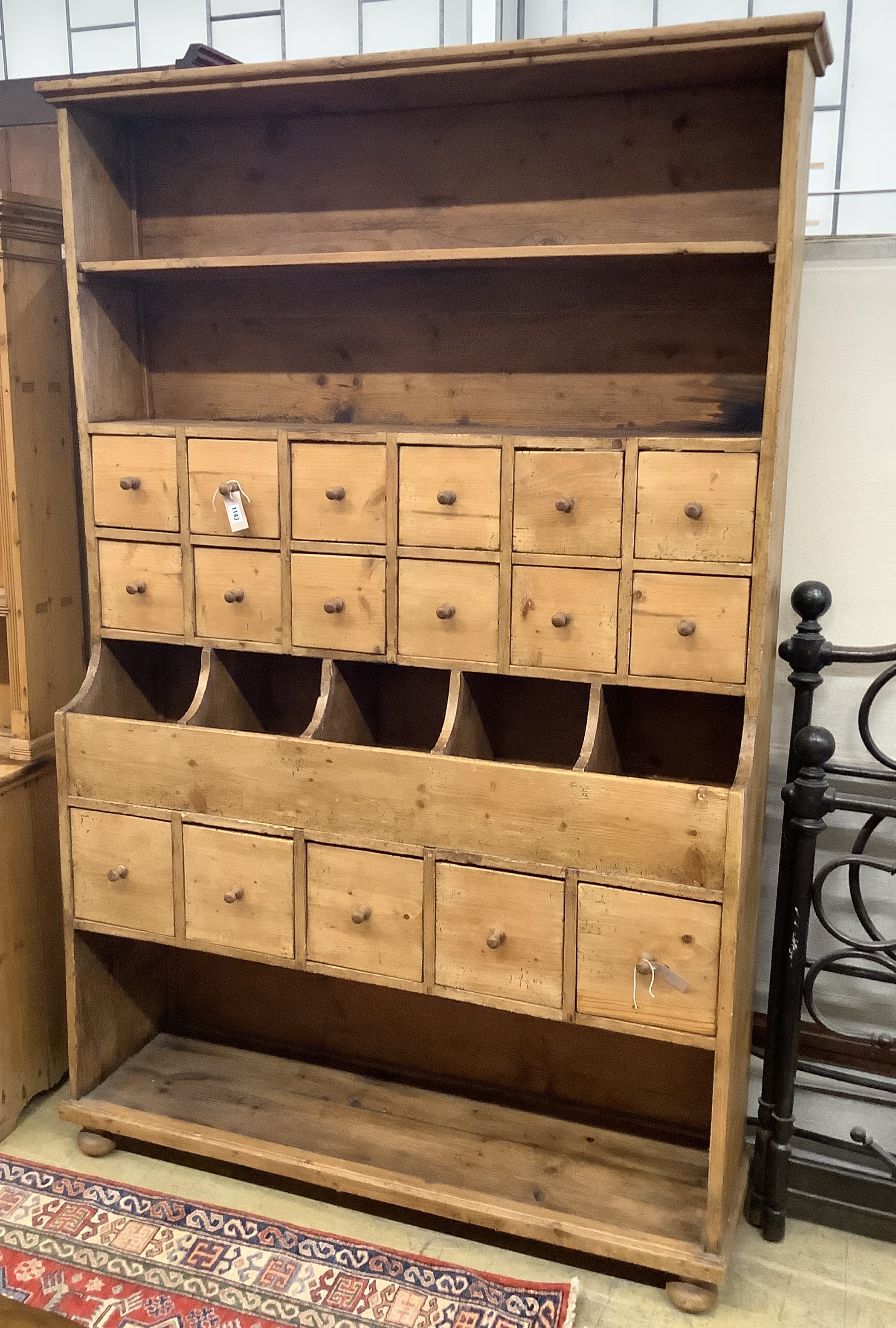 A Victorian pine grocer's shop cabinet